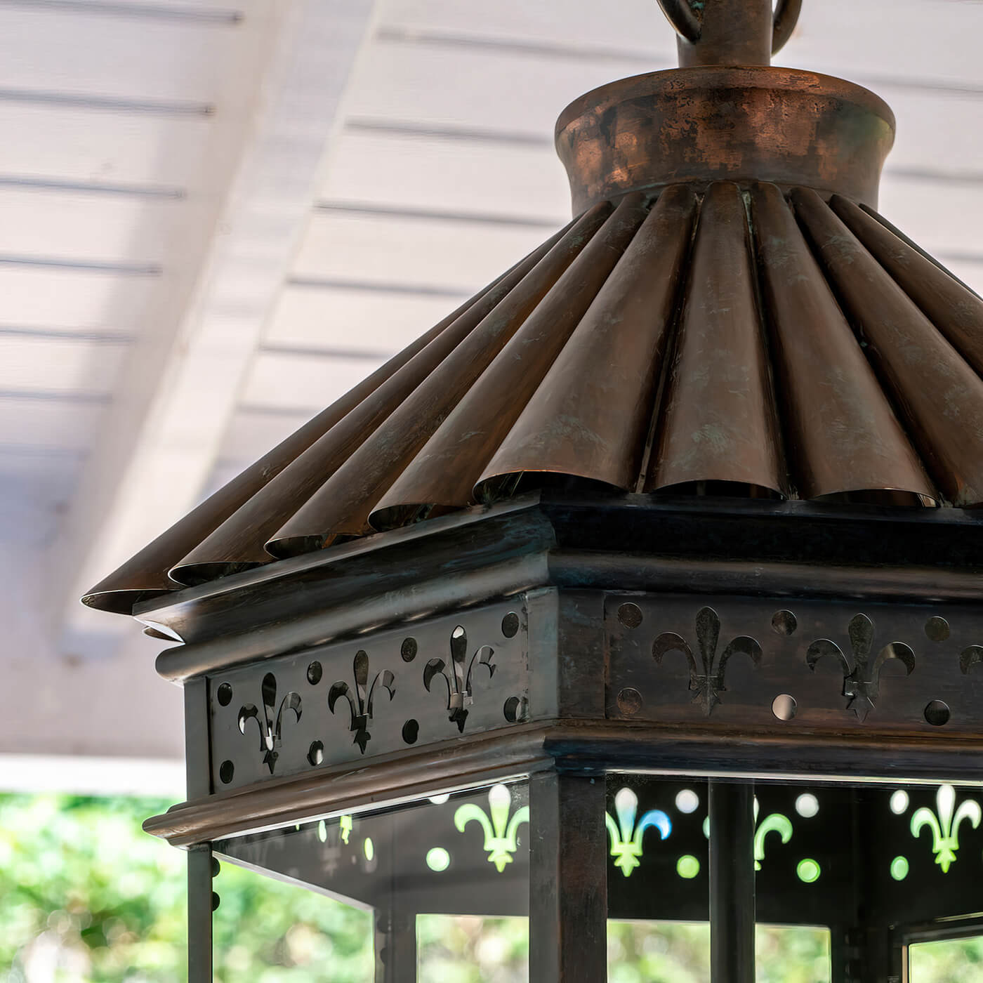 Lantern top detail, copper bronze material, unique roof design.