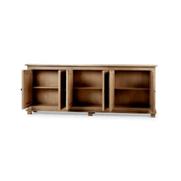 Open cabinet doors of sideboard, showing interior shelves.