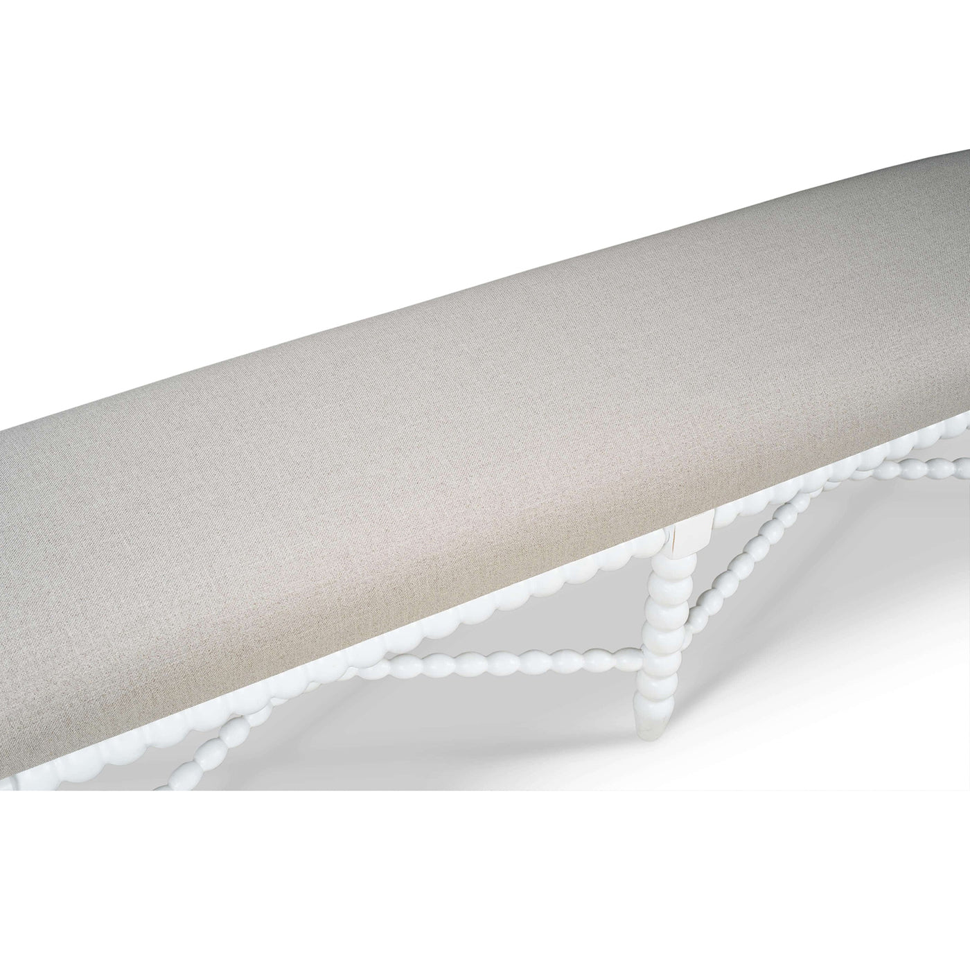 Top view of white bench with light upholstered seat.