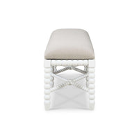 Side view of white bench with textured seat.