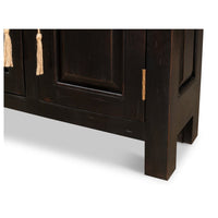 Lower corner detail of painted buffet sideboard legs.