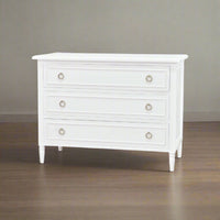 White chest of drawers, angled room view.