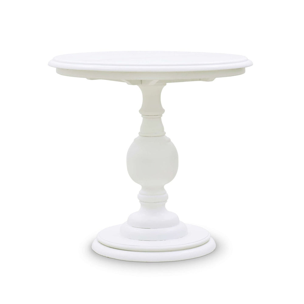 White pedestal end table, side angle view.
