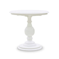 White pedestal end table, side angle view.
