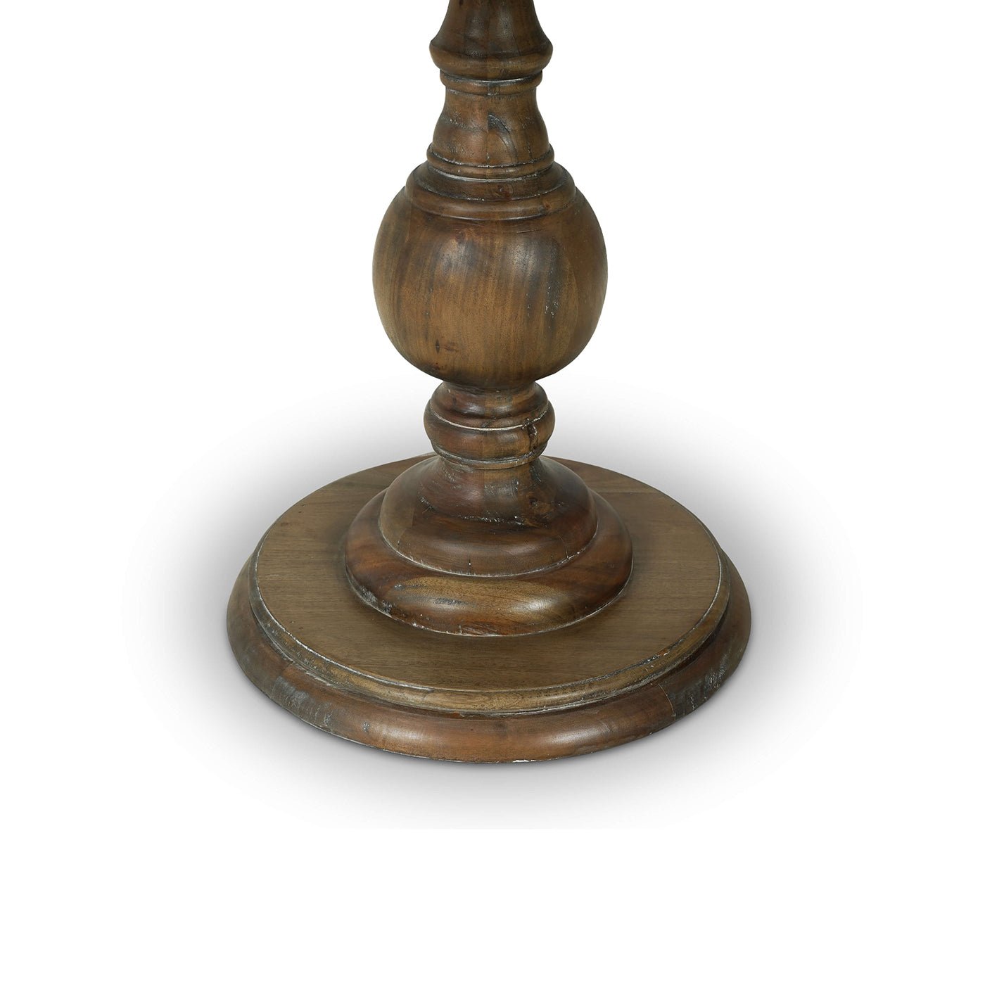 Close-up of pedestal end table base, turned wood design.
