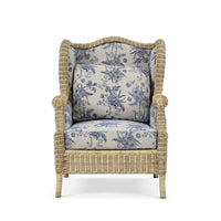 Front view of rattan wingback chair with cushions.