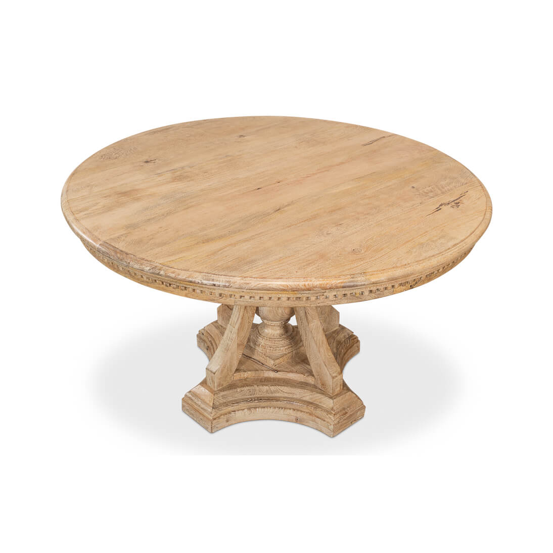 Top-down view of round dining table, wooden texture visible.