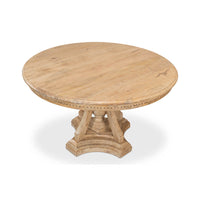Top-down view of round dining table, wooden texture visible.
