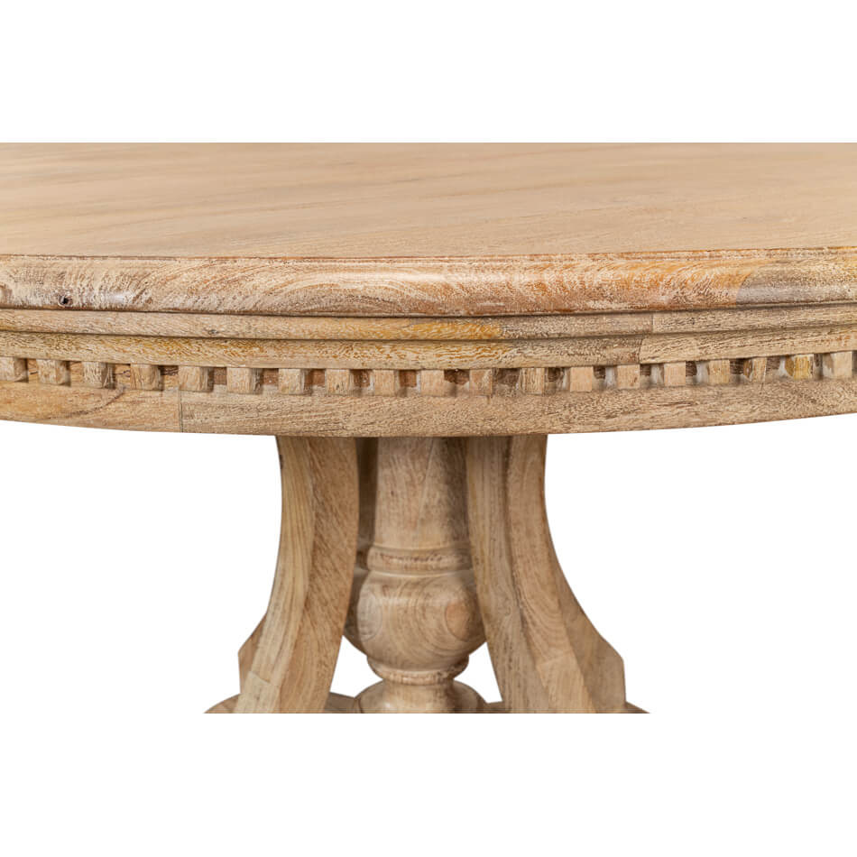 Close-up of dining table base, intricate woodwork design.
