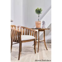 Wooden end table next to chair in bright room.