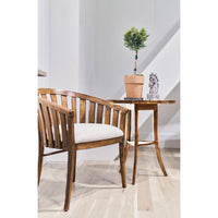 Round end table in room setup with chair and decor.