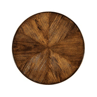 Top view of round walnut table with unique pattern.