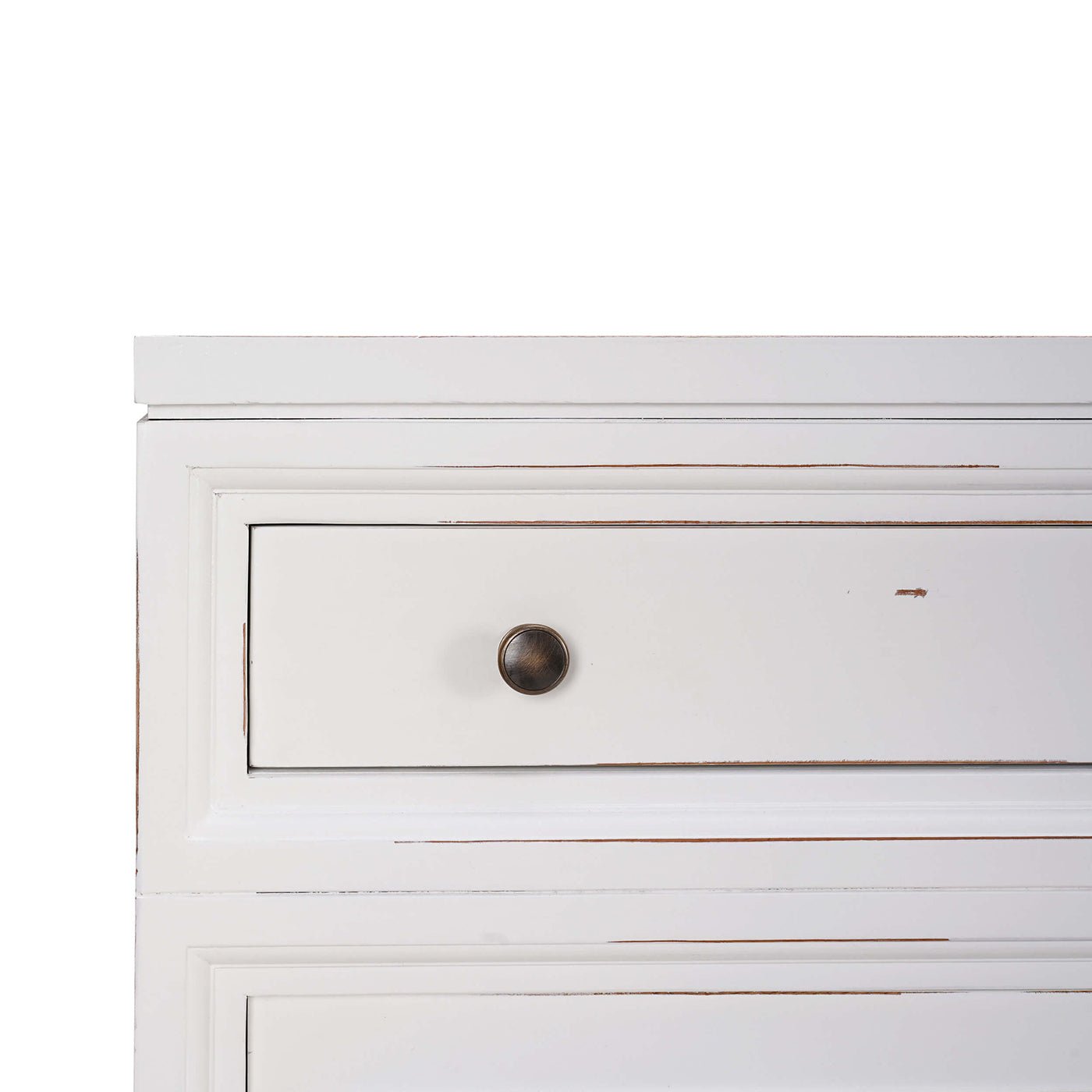 Close-up of white credenza's drawer with round knob.
