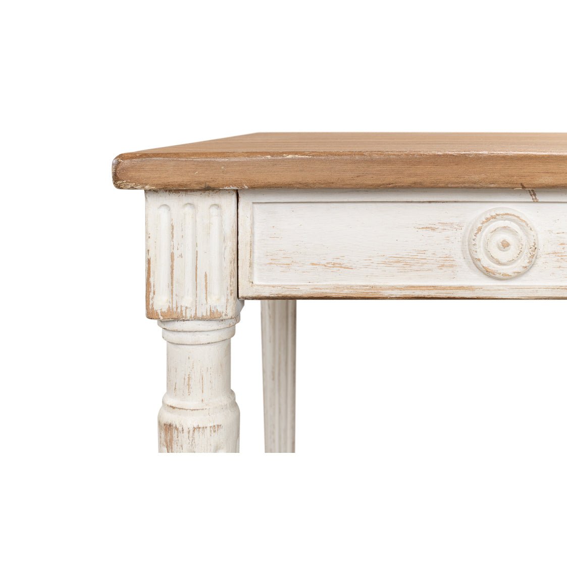 Rustic dining table, close-up of corner and circular carvings.