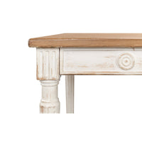Rustic dining table, close-up of corner and circular carvings.