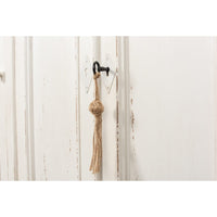 French country sideboard, door detail with tassel, close-up
