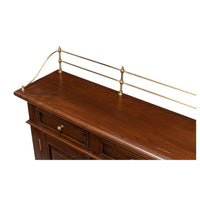 Top view of railing on walnut buffet sideboard.