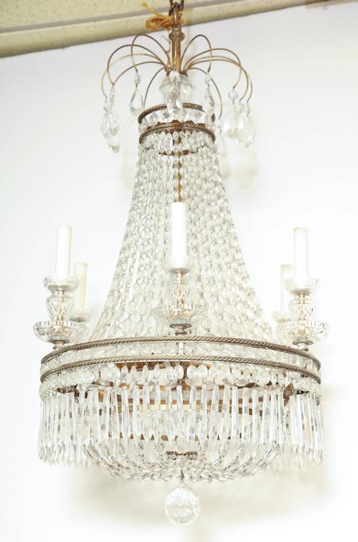 French six-light chandelier, side view with candles.