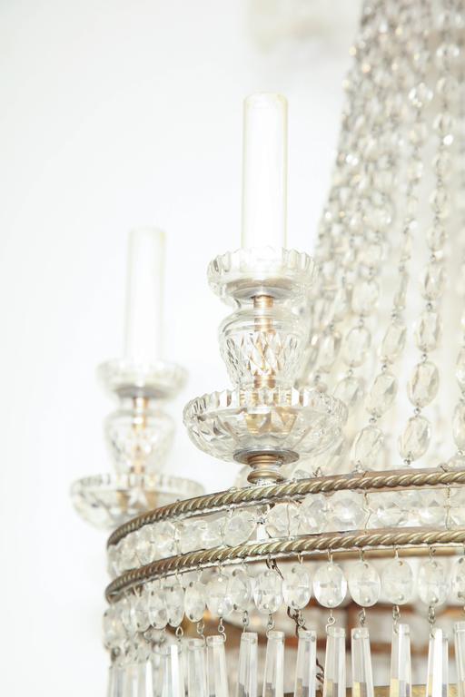 Detail of crystal candle holders on chandelier.