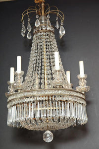 Side view of chandelier with candle lights, luxurious look.