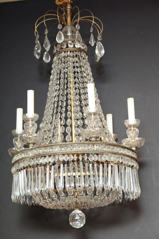 Side view of chandelier with candle lights, luxurious look.