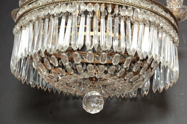 Bottom view of chandelier, intricate crystal arrangement.