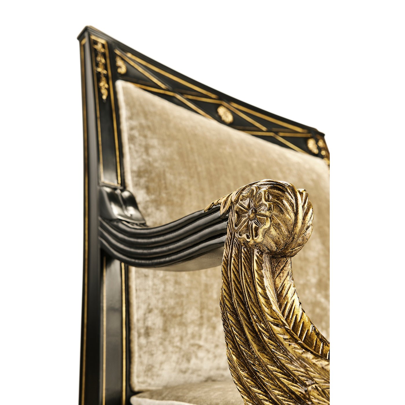 Side view of French Empire armchair armrest carving.