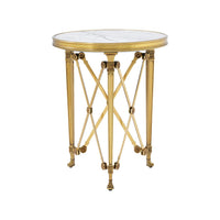 Close-up of round accent table's intricate gold design.