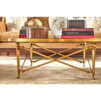 Coffee table with decorative items in cozy setting.