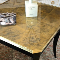 Decorated gold tabletop on luxe end table.