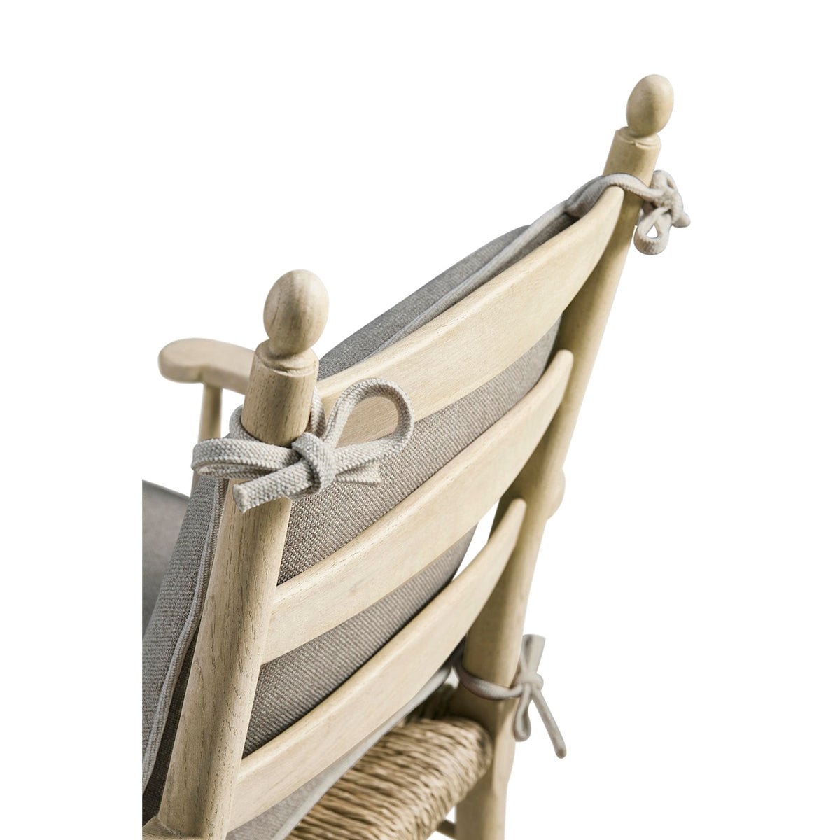 Rear view of tied cushions on ladderback arm chair.