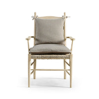 Front view of ladderback arm chair, cushioned, symmetrical.