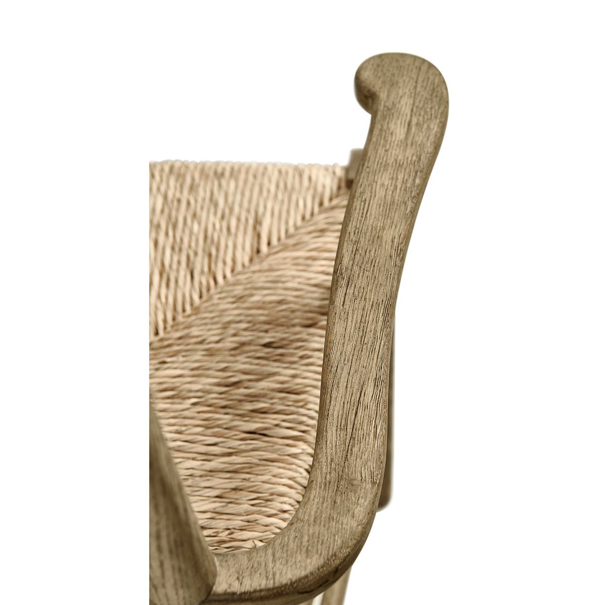 Armrest detail and woven texture on ladderback chair.