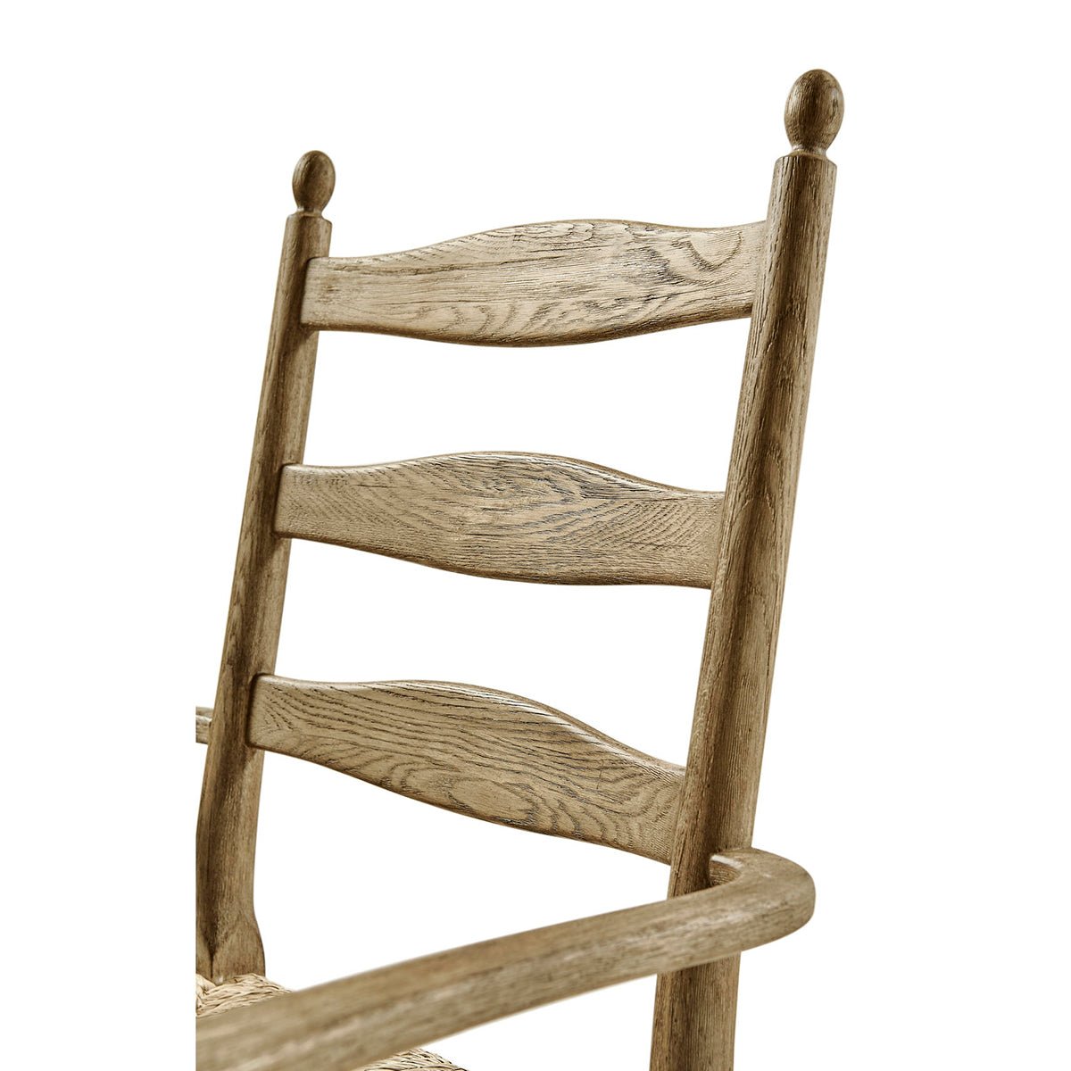 Close-up of ladderback chair backrest detail and texture.