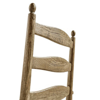 Ladderback and finial detail on chair back.