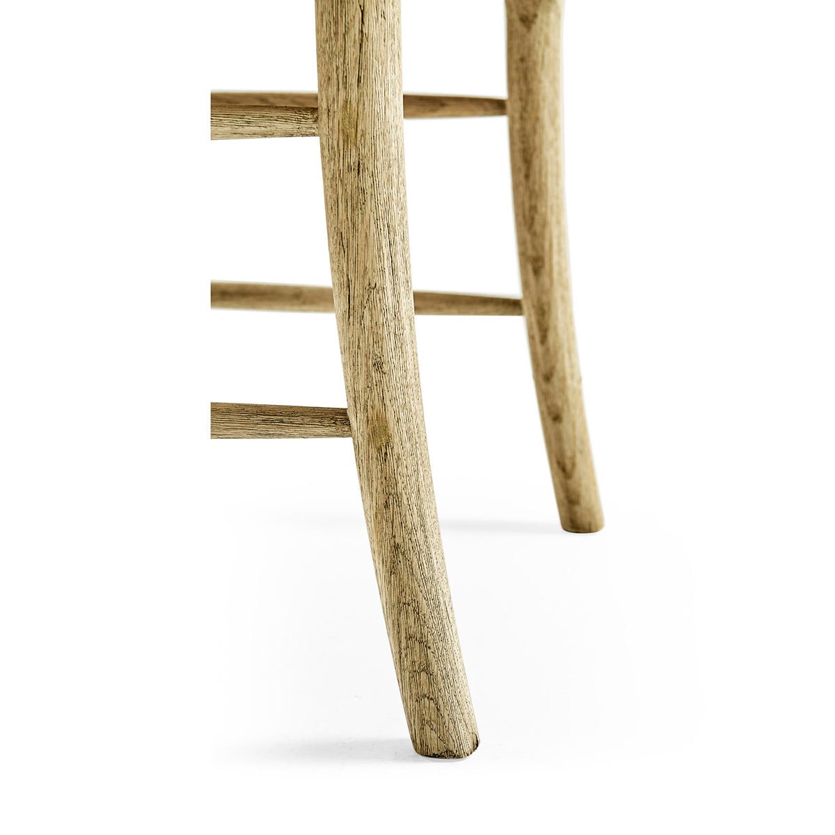 Wooden chair leg close-up, natural texture visible.