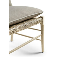 Chair with woven seat and cushion, side detail.