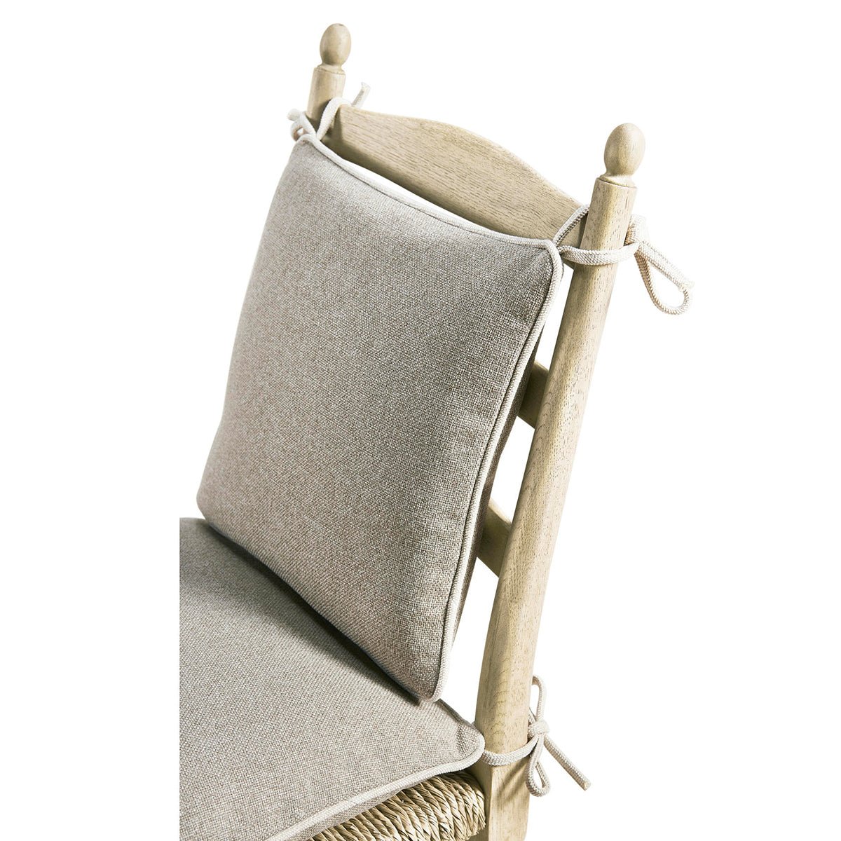 Cushion and tie detail on ladderback dining chair.
