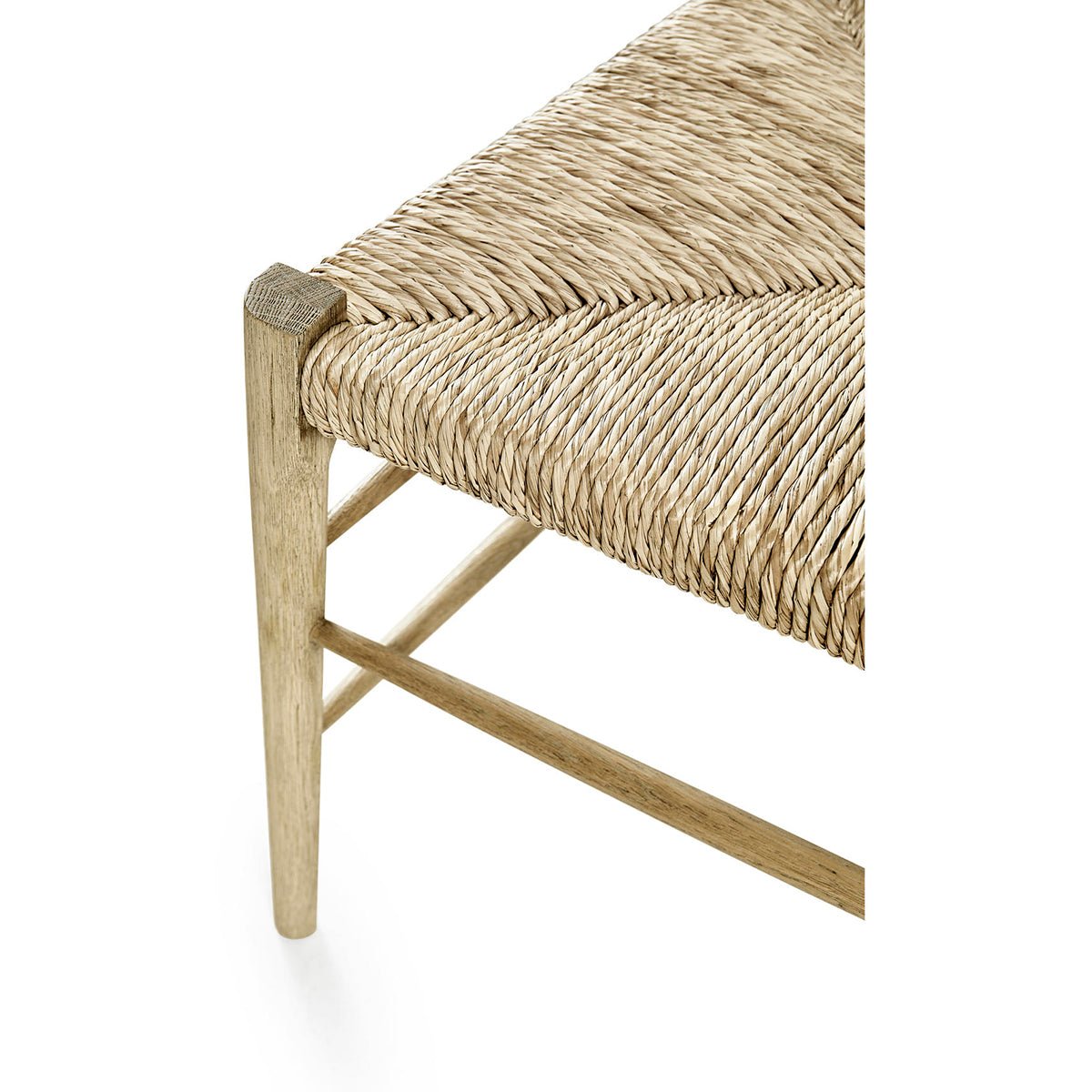 Woven seat detail on ladderback dining chair.