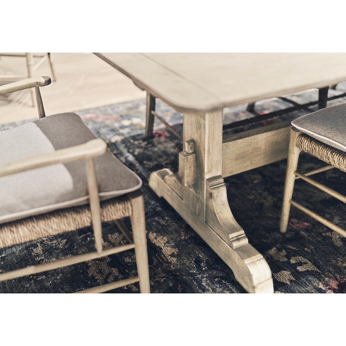 Dining table with ladderback chairs, corner perspective.