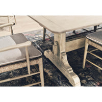 Dining table with ladderback chairs, corner perspective.