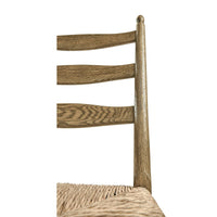 Detail of ladderback chair wood finish and seat.