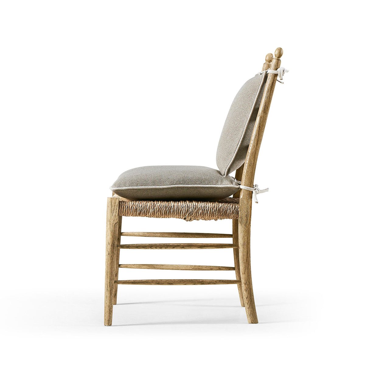 Side profile ladderback dining chair with cushions.