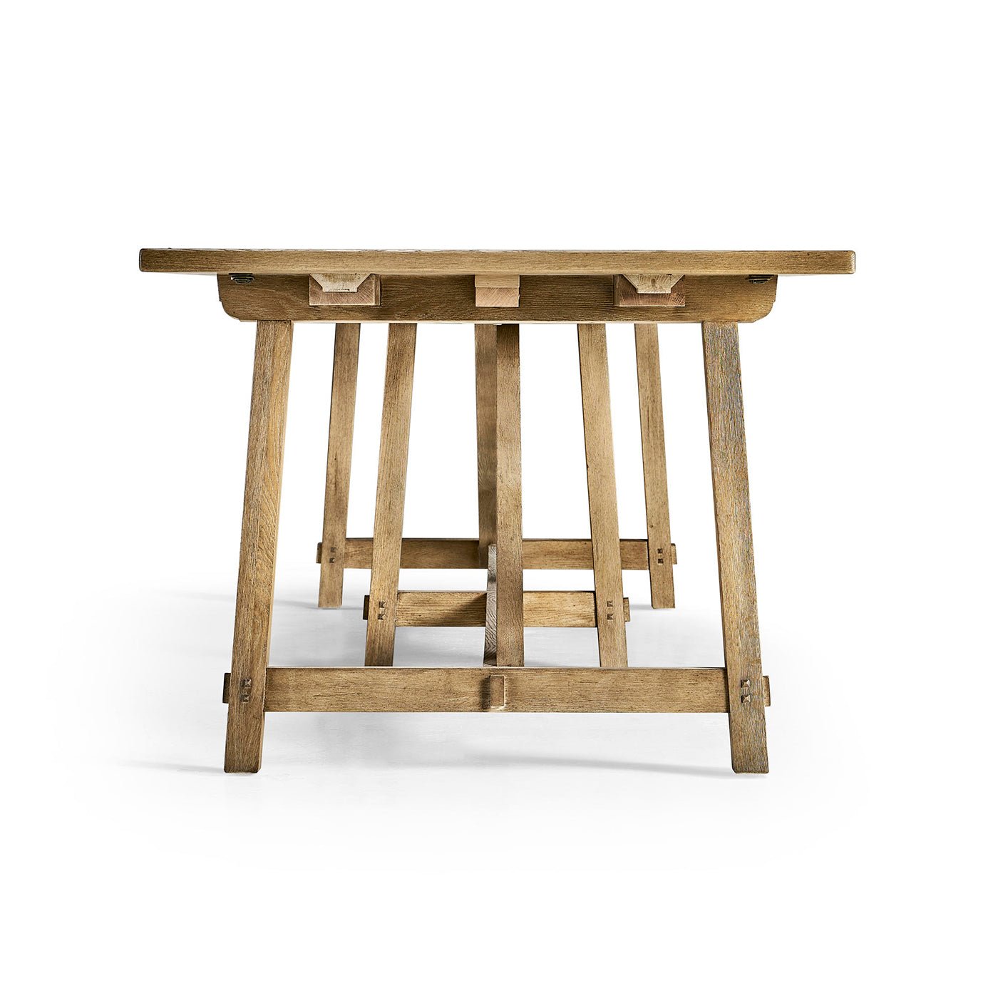 Dining table close-up, end view of trestle legs.