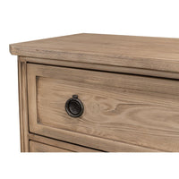 Close-up of drawer with round metal handle, oak dresser.