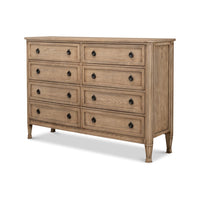 Side angle of French oak dresser with eight drawers.