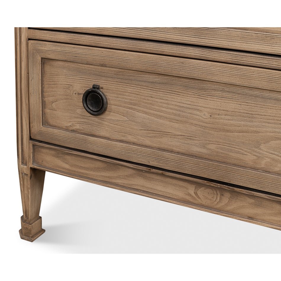 Lower section of oak dresser with leg design.