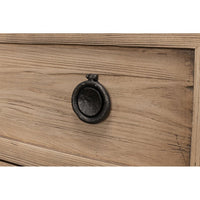 Detail of metal handle on oak dresser drawer.