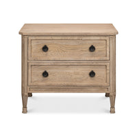 Front view of light oak nightstand showing drawer knobs.