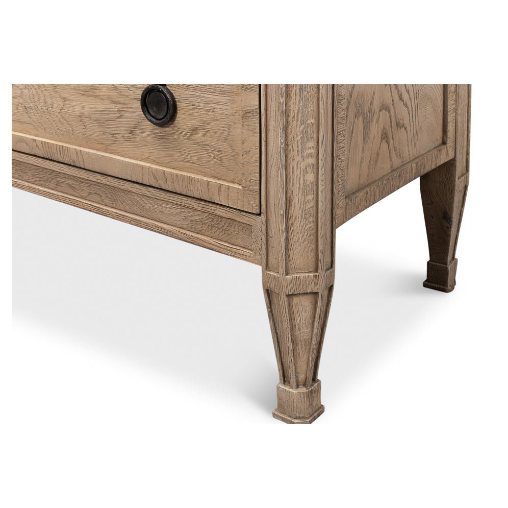 Nightstand leg design and lower drawer detail close-up.